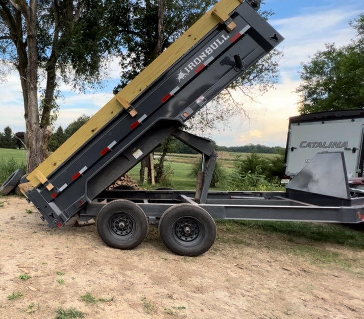 Ironbull dump trailer with hydraulic bed raised - Lonestar Trailer Rentals